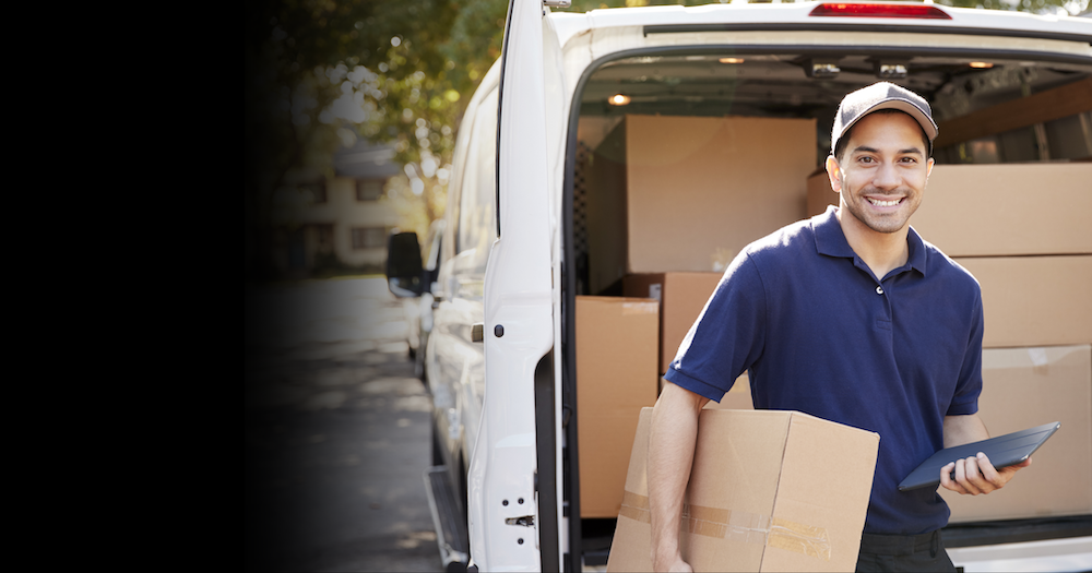 courier using a mobile device to scan package barcodes