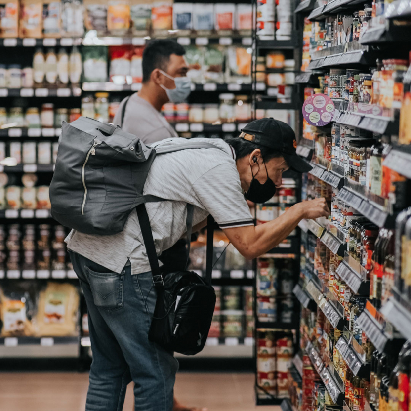 Man looking for some items in a supermarket