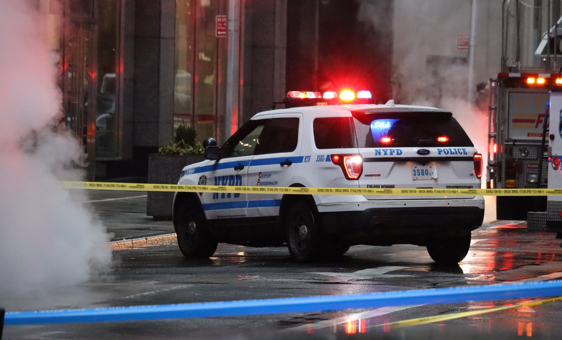 Police car in front of a no-cross line