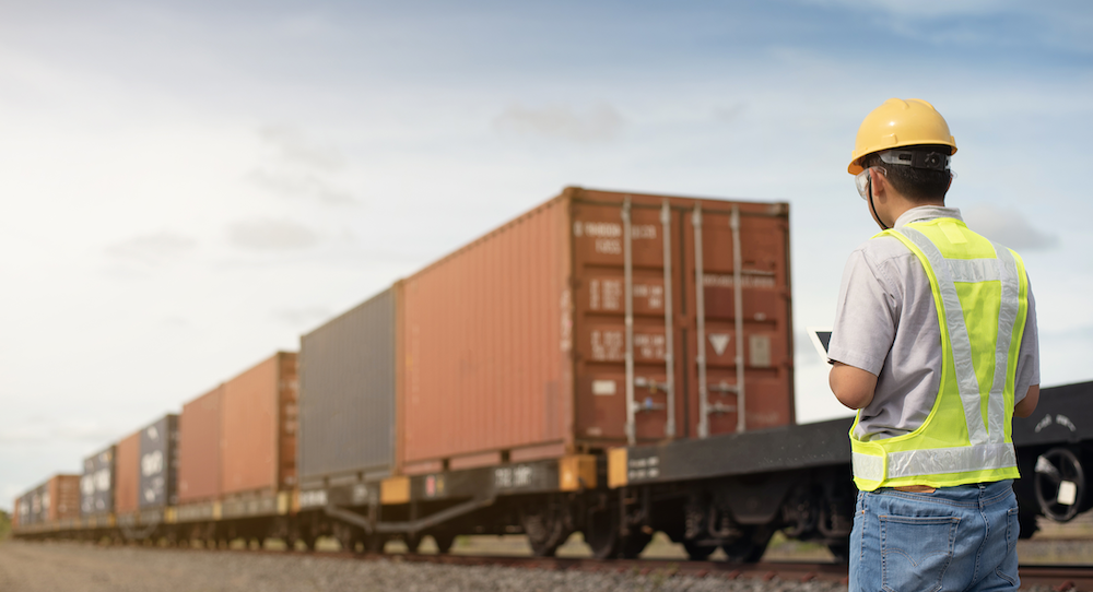 man scanning container numbers with a mobile device