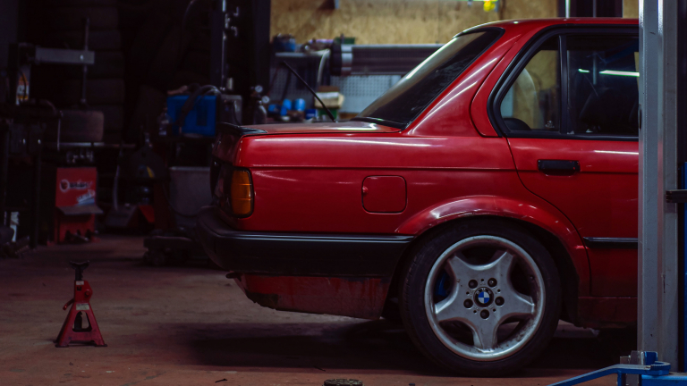 red car in a repair shop