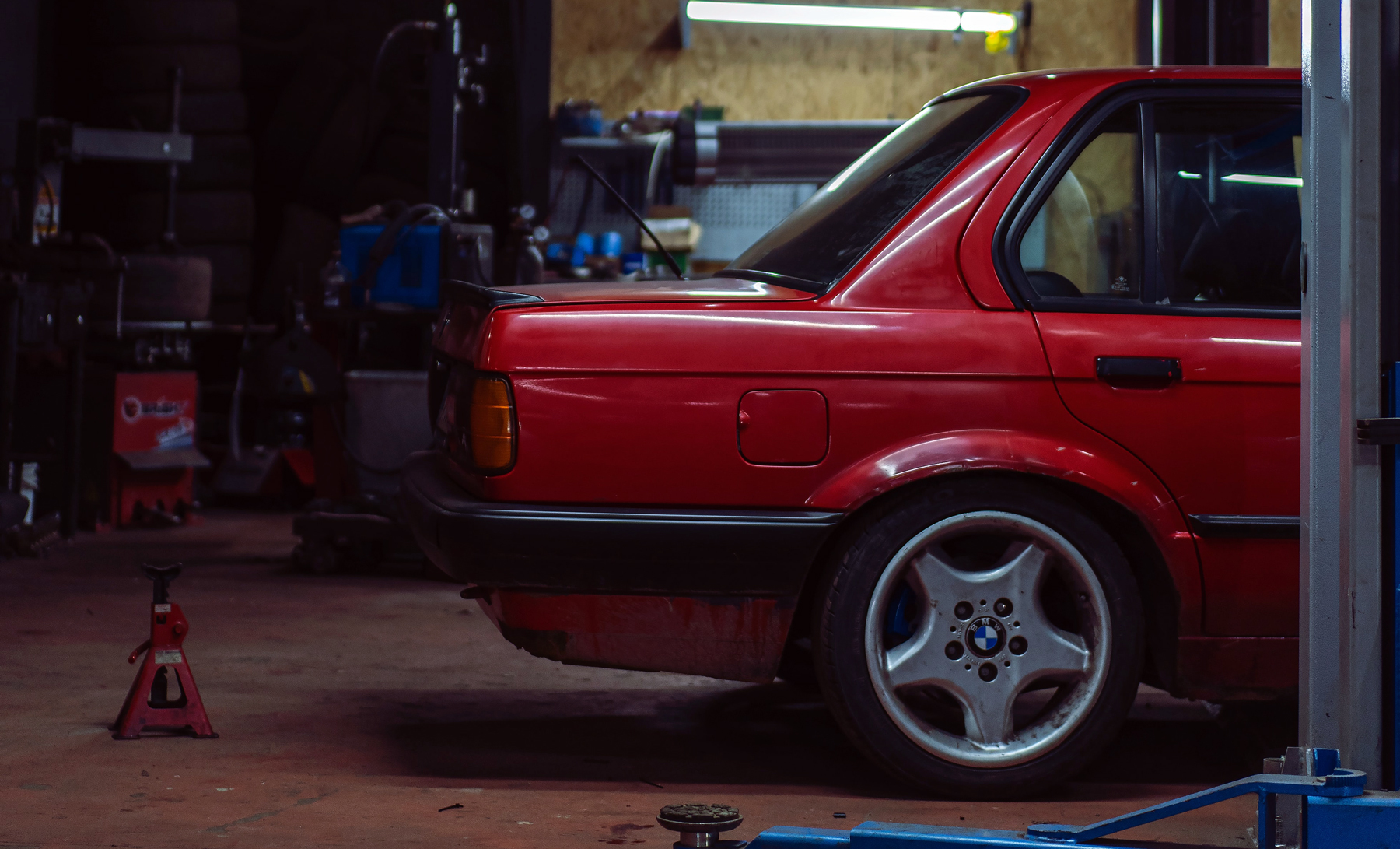 red car in a repair shop