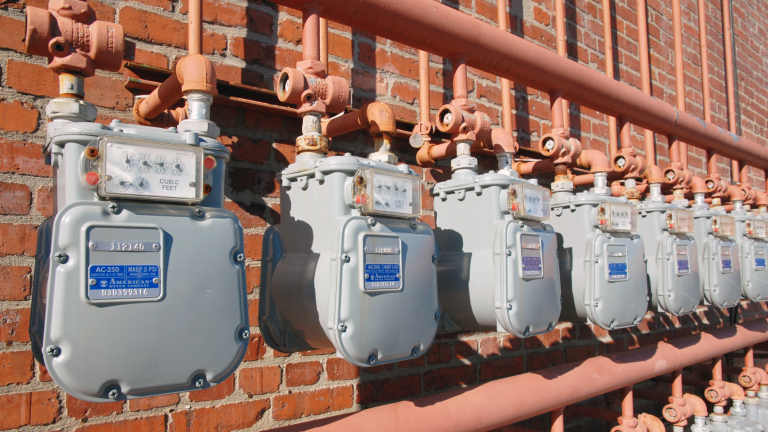 water meters on a brick wall