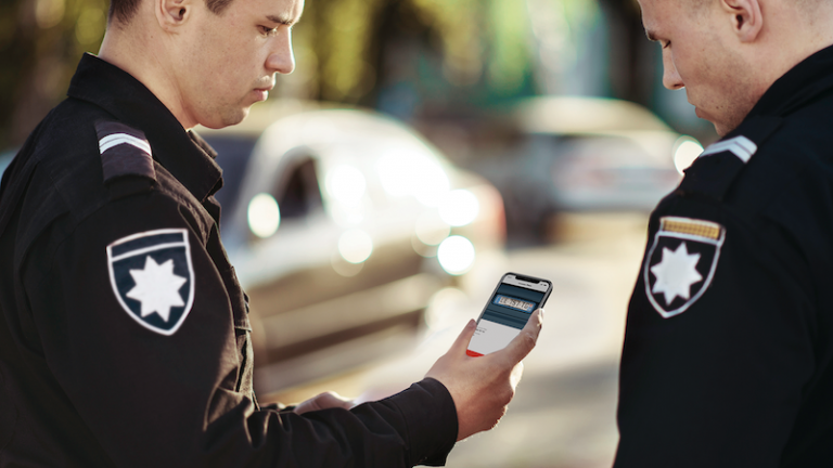 police officers scanning a license plate