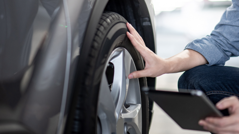 Person using a mobile Tire scanner for tire services