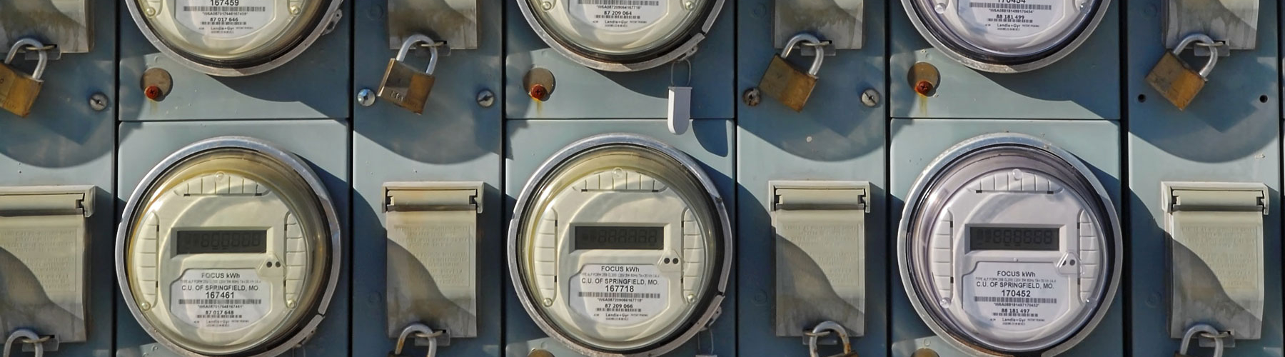 multiple electricity meters on a wall