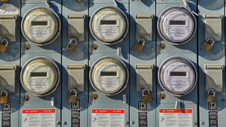 multiple electricity meters on a wall