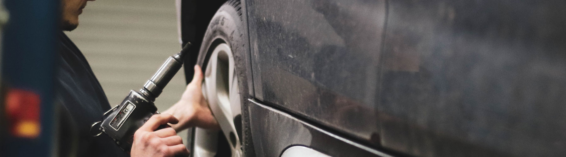 technician working on a tire