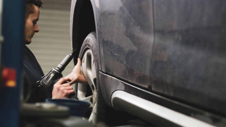 technician working on a tire