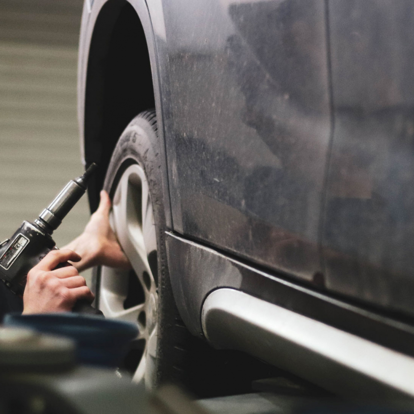 technician working on a tire