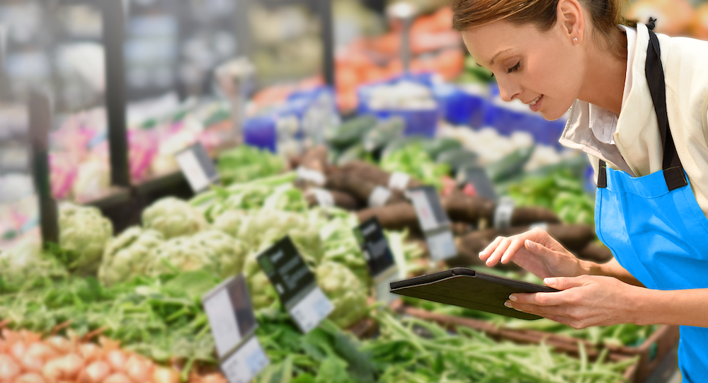 woman checking inventory with an ipad