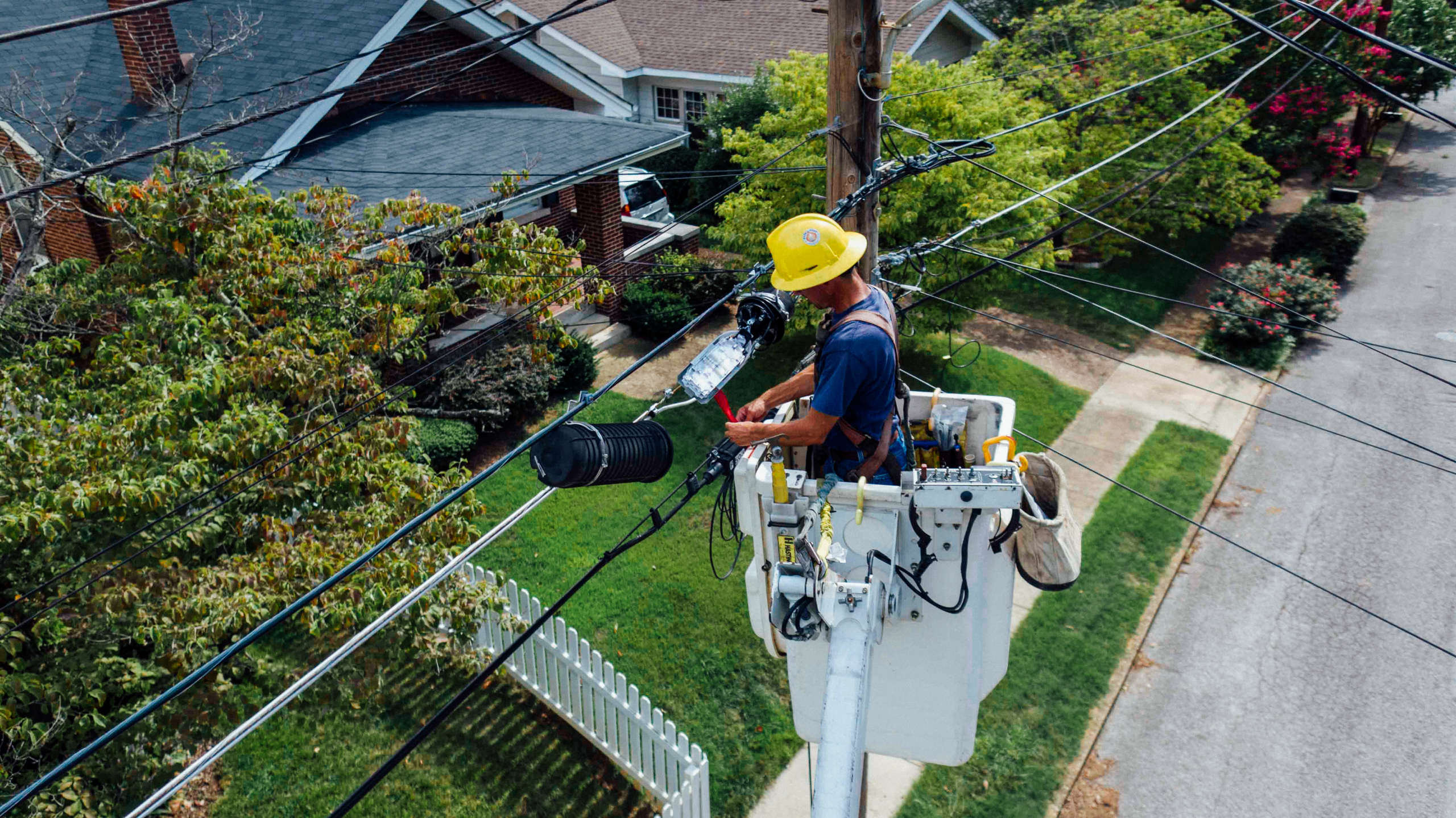 Man repairing power pole