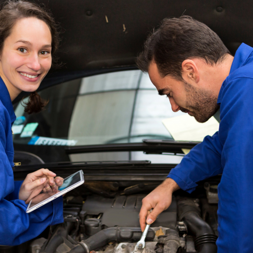 Team of mechanics working at the garage