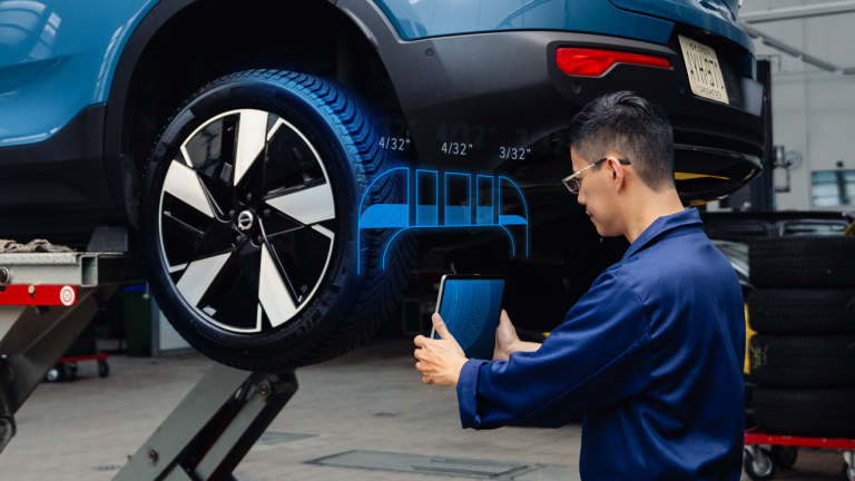 Technician scanning a tire tread