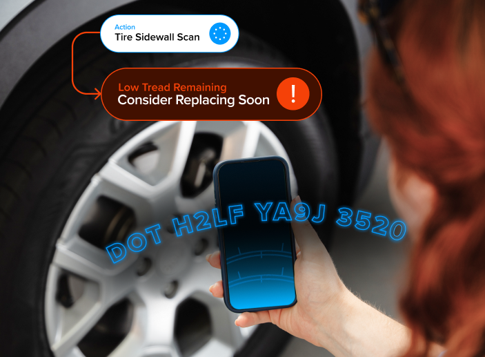 A persone scanning tire information with a smartphone