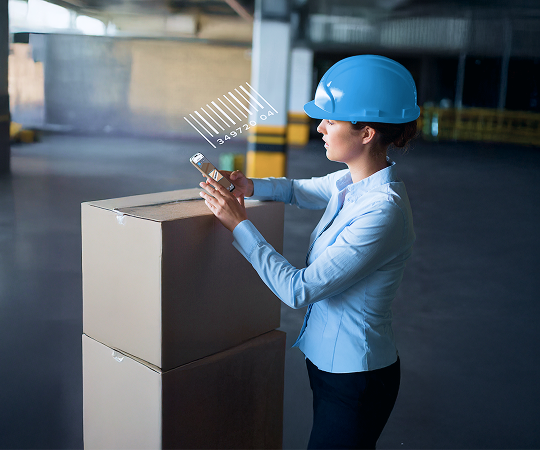 Worker scanning barcodes on a package