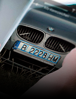 A smartphone showing a license plate scanner interface