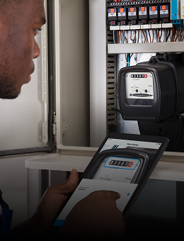 A man checking the results after having scanner a meter with a tablet