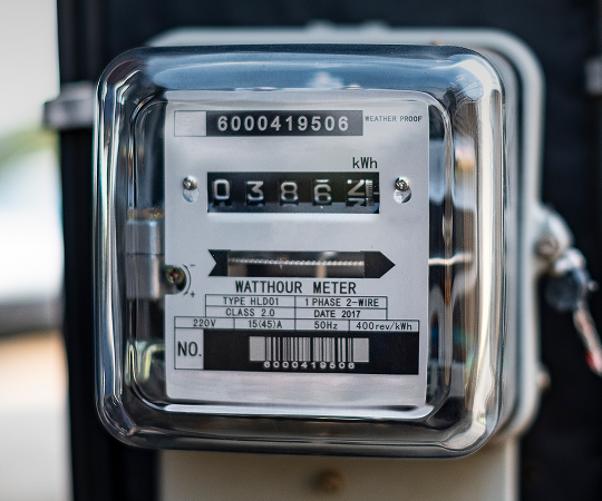 Closeup of an analog electricity meter.