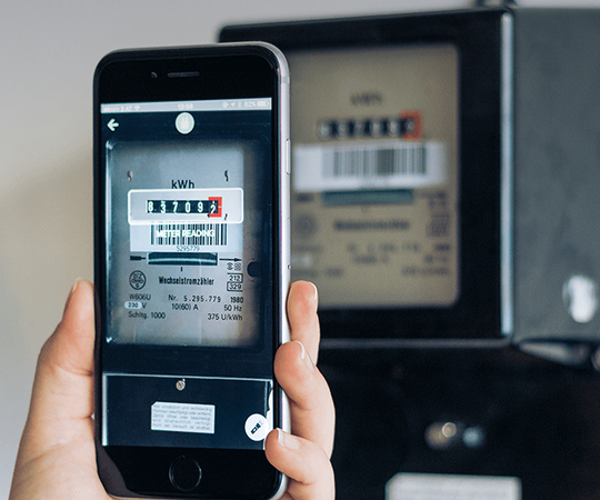 A smartphone scanning a meter