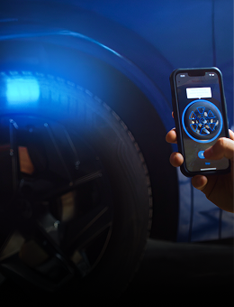 A smartphone scanning a tire