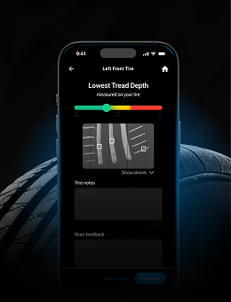 A smartphone showing a tire tread scanner interface