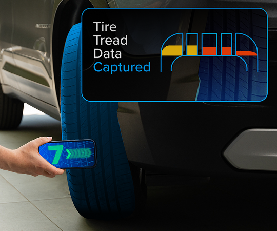 A smartphone performing a tire tread scan