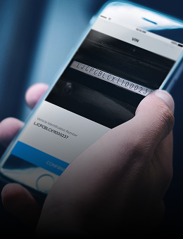 A smartphone showing the scan of a VIN