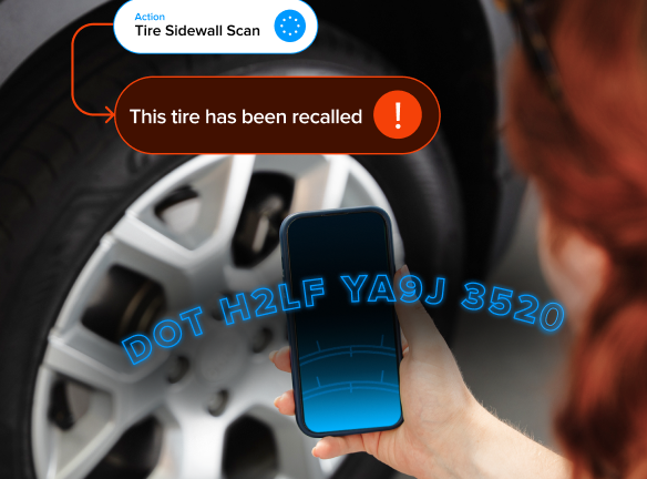 A person scanning tire sidewall information with a smartphone