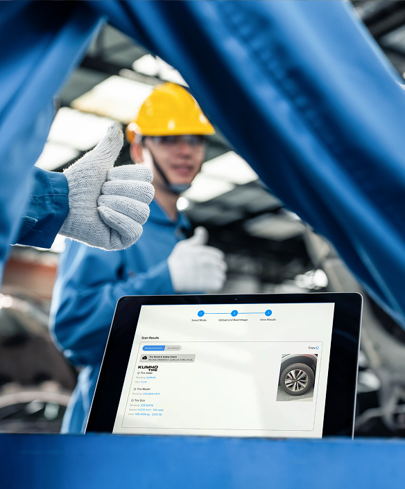 A tablet showing a tire scanned with the Anyline scanner in car repair shop