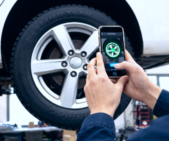 Technician scanning a tire sidewall