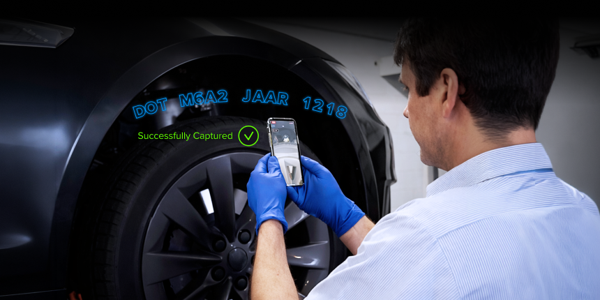 Technician using the TireBuddy App to scan a tire's DOT code directly from the sidewall, with AR overlay highlighting the code and a 'Successfully Captured' confirmation